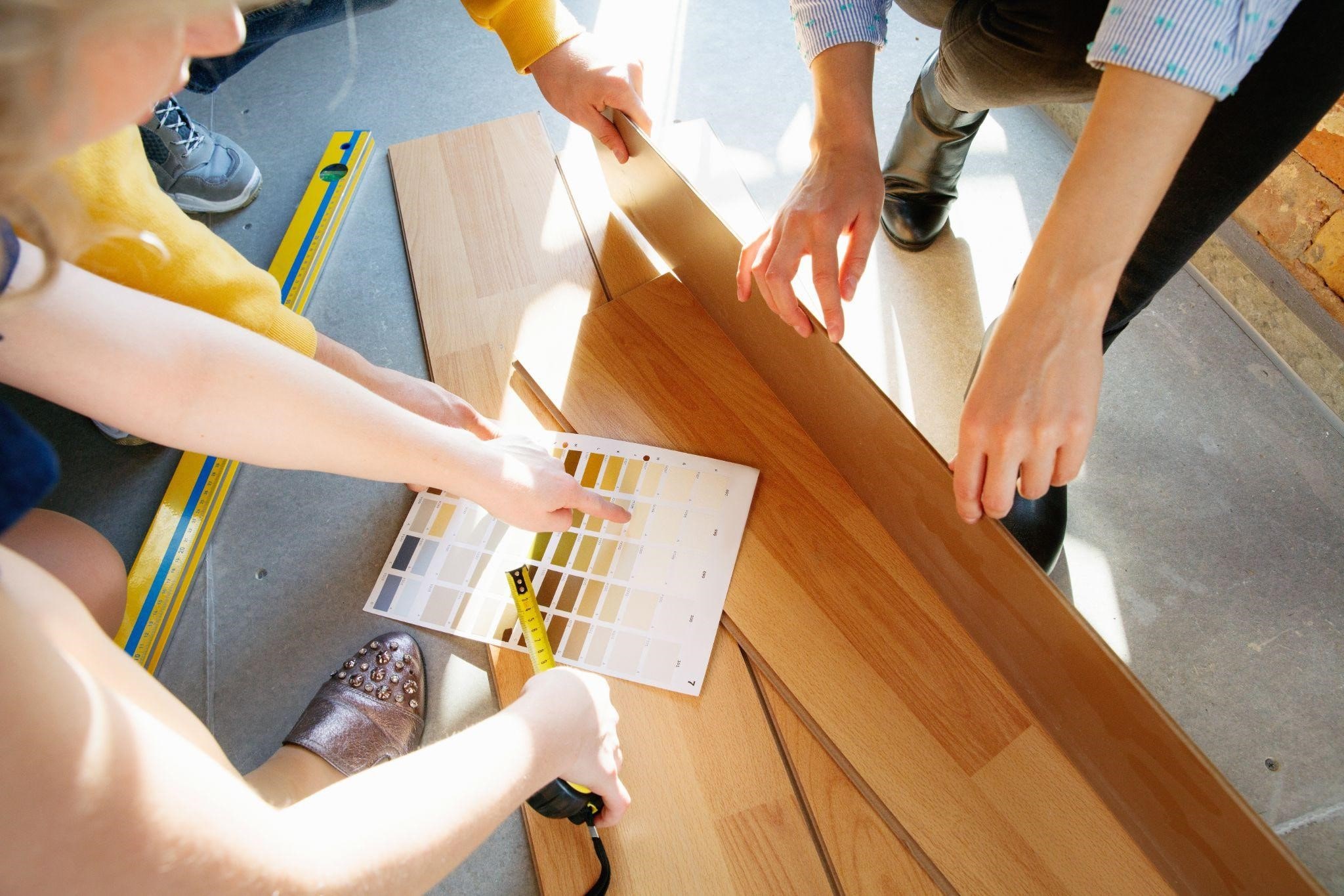 Image illustrating an interior designer in New York working with a young couple
