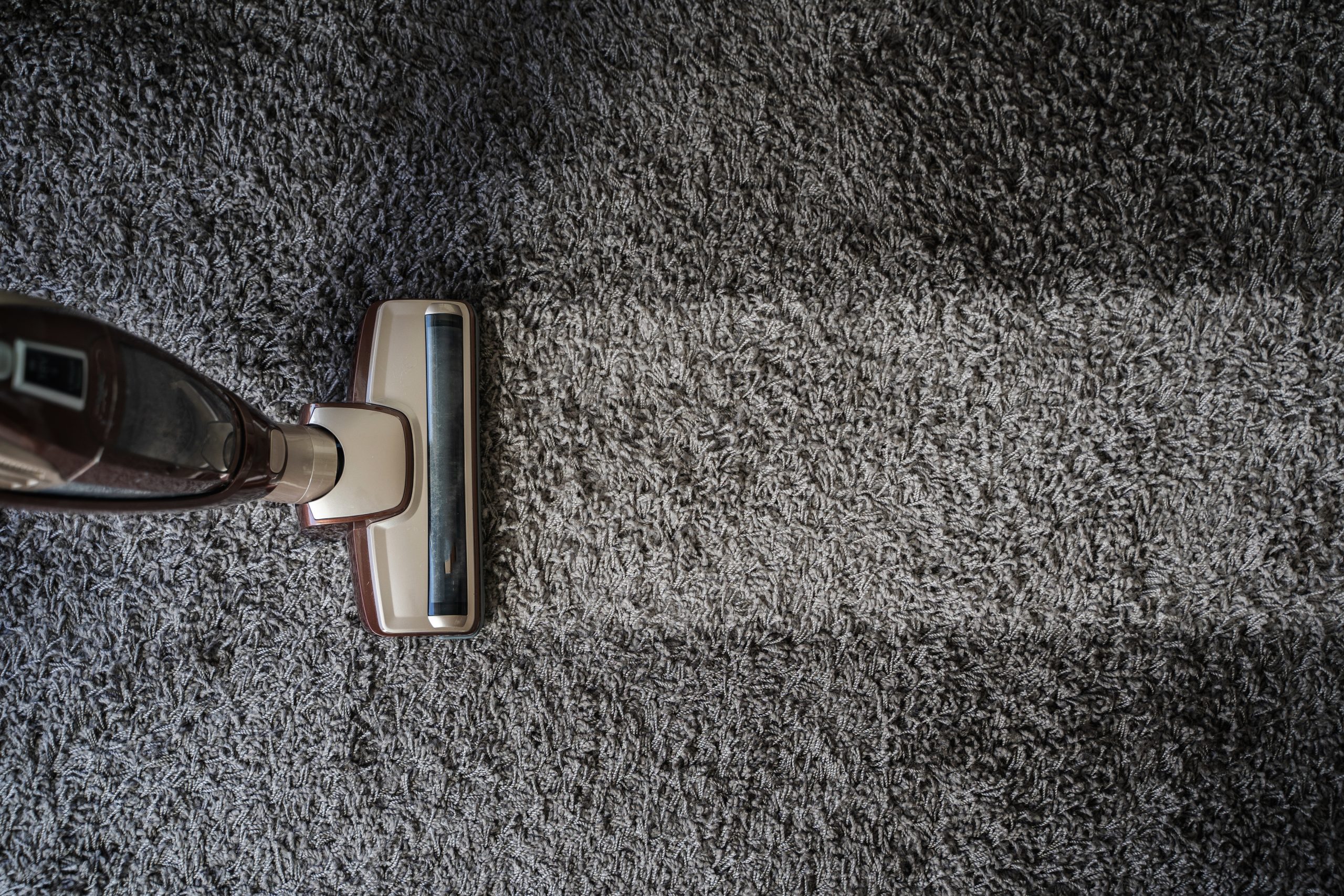 Close-up Of man using A Vacuum Cleaner professional vacuum cleaner in New York