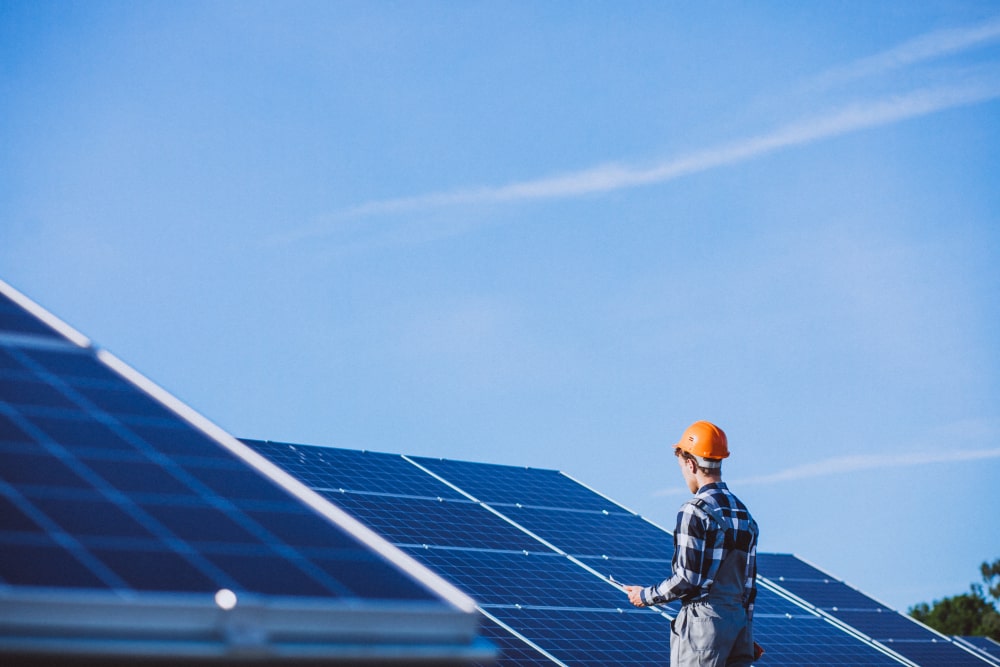 Image illustrating electrician working on alternative energy systems