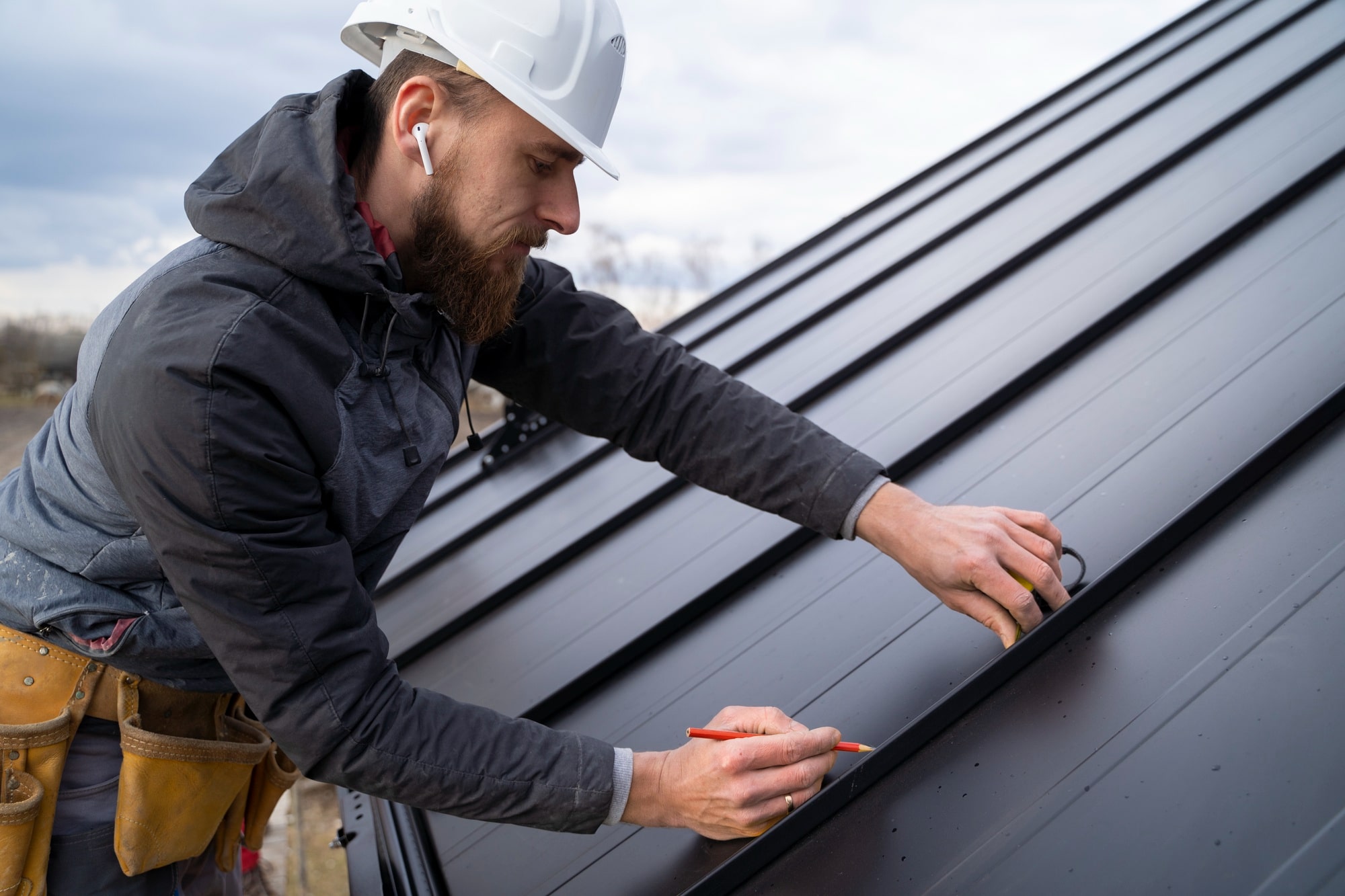 Image illustrating professional electrician working on thermal isolation