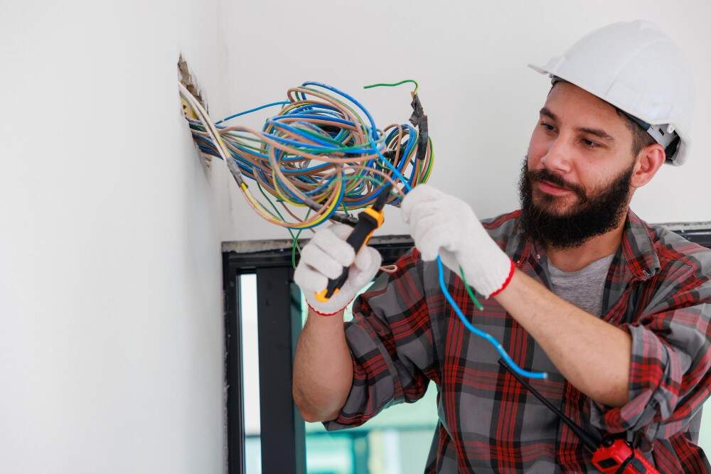 Image illustrating a professional electrician in New York working on electrical repairs